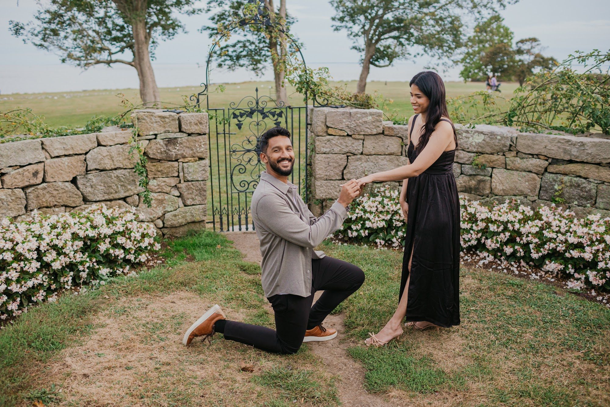 Couple embrace during engagement session — New England