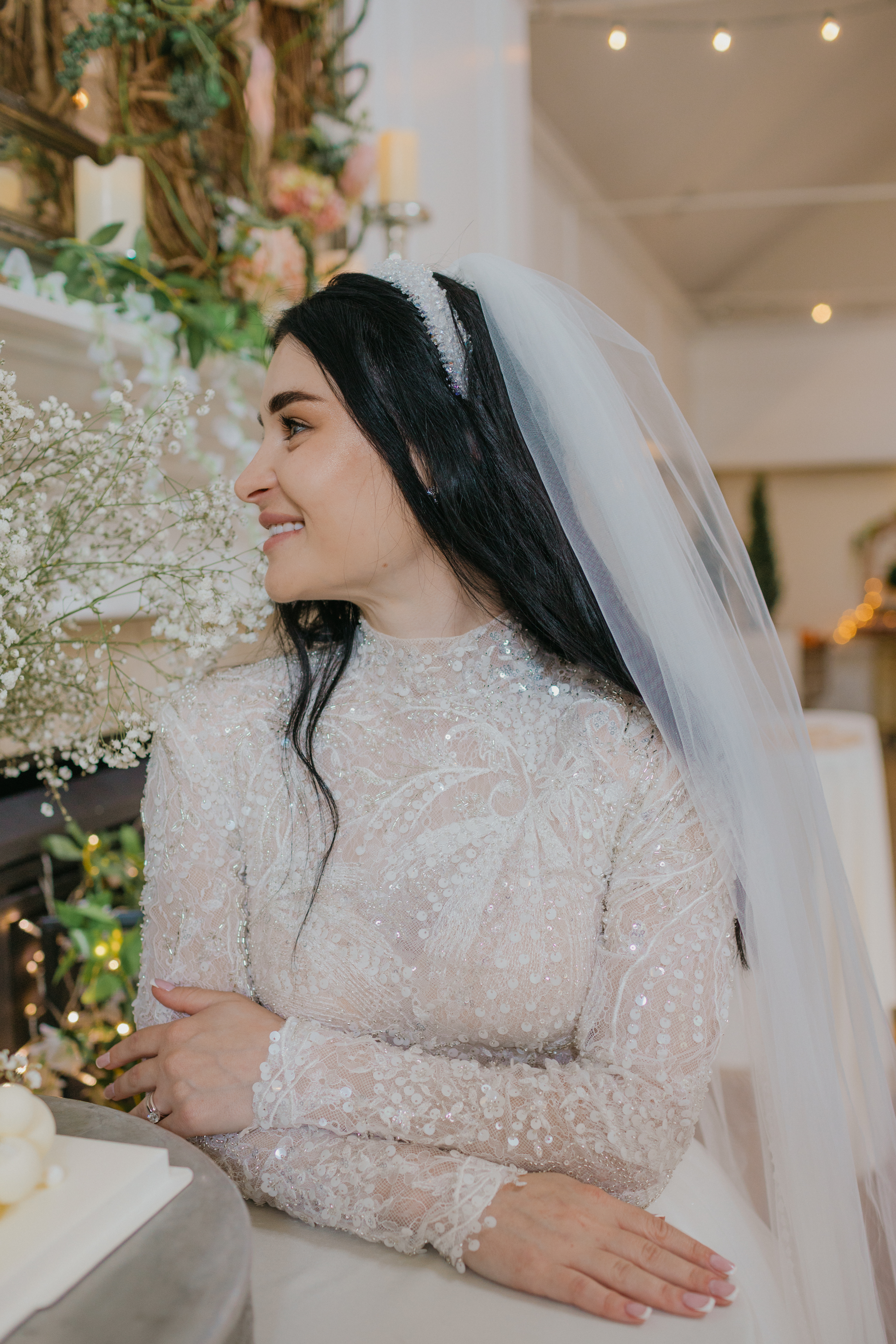 Candid embrace between bride and groom in the woods