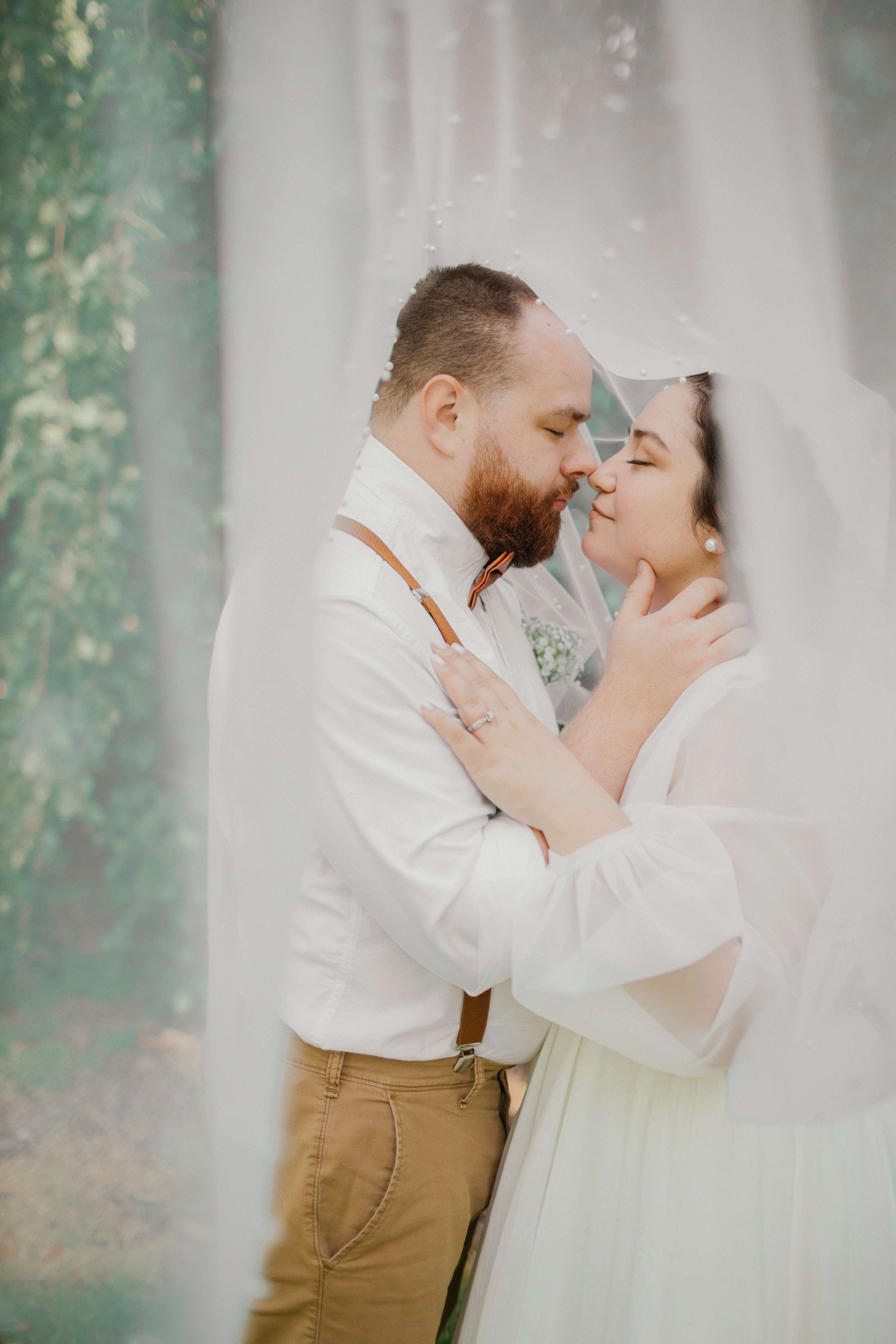 Bride and groom candid moment in the garden