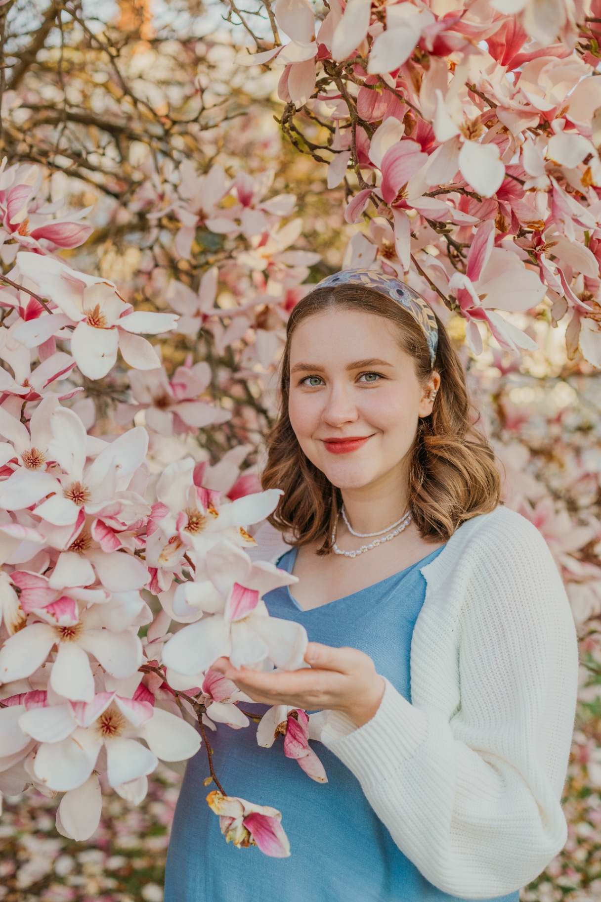 Portrait of a young woman among magnolia flowers — Connecticut portrait photographer