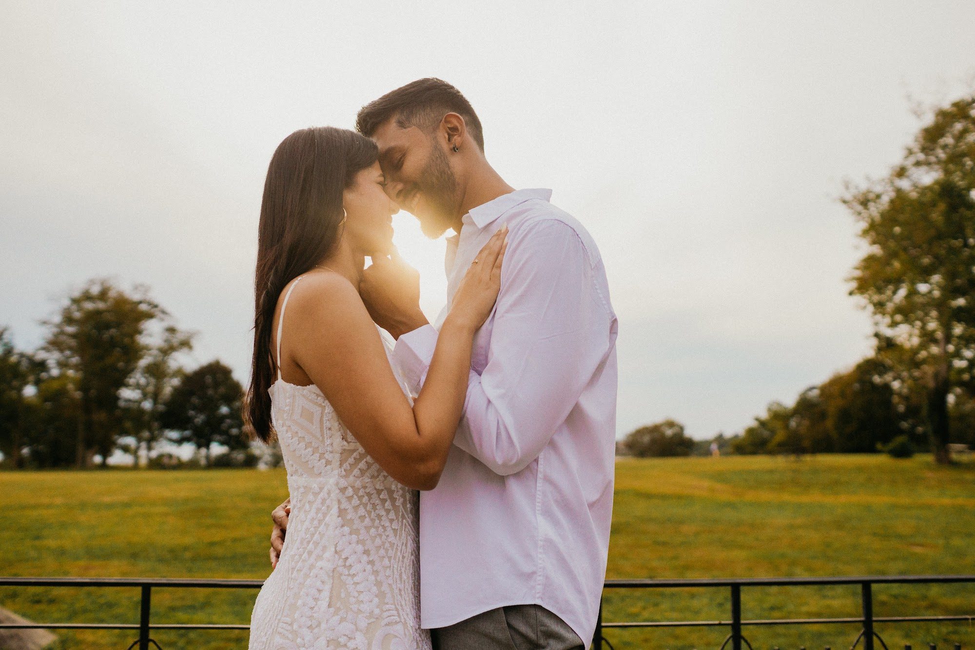 Engaged couple in a quiet candid moment outdoors