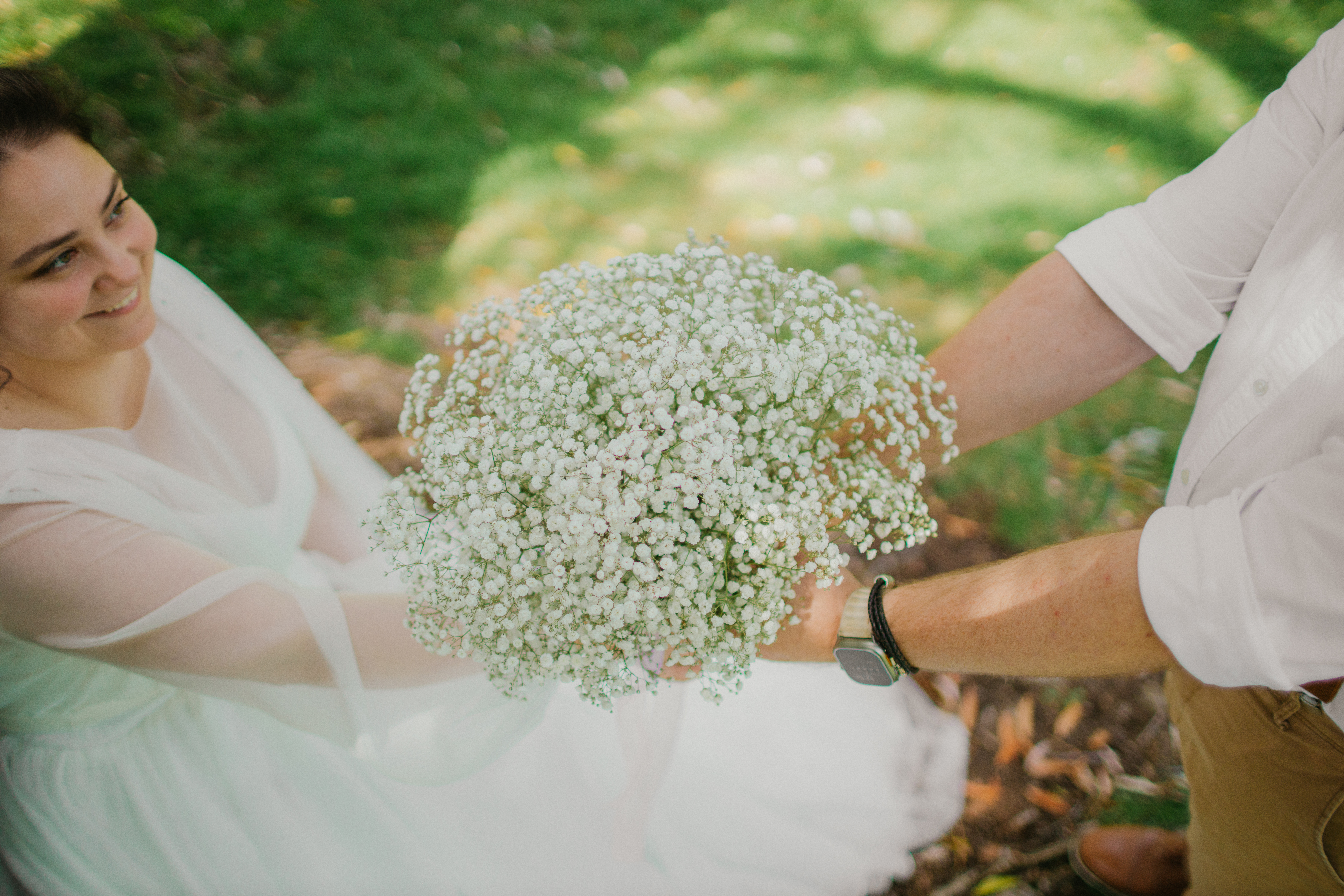 Bride and groom in warm garden light