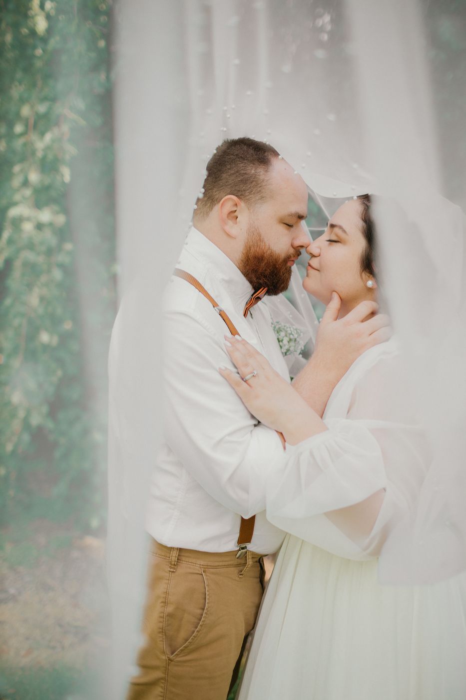 Bride and groom candid moment in the garden